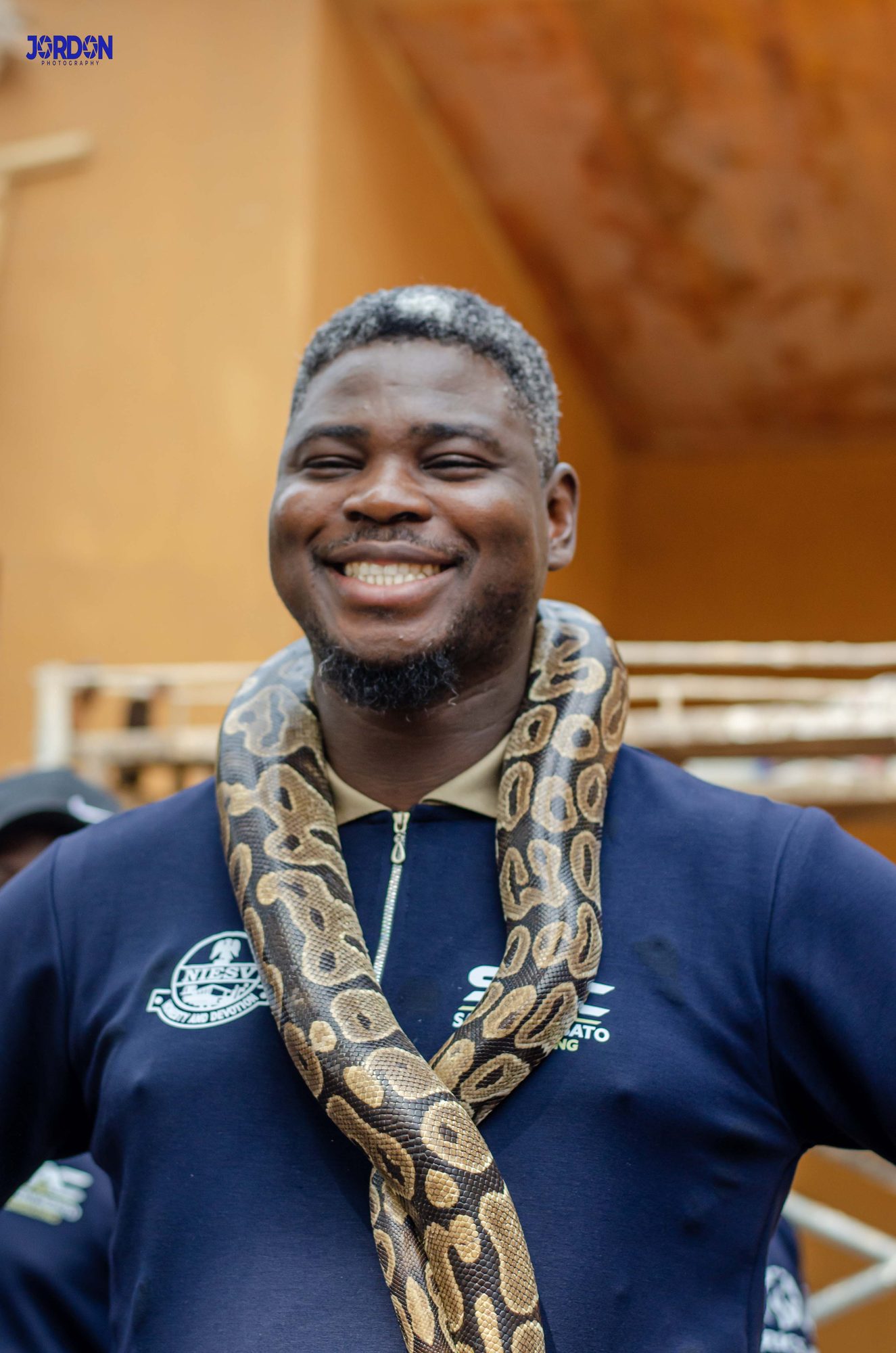 A traveller meeting a royal python at the Temple of Pythons in Ouidah